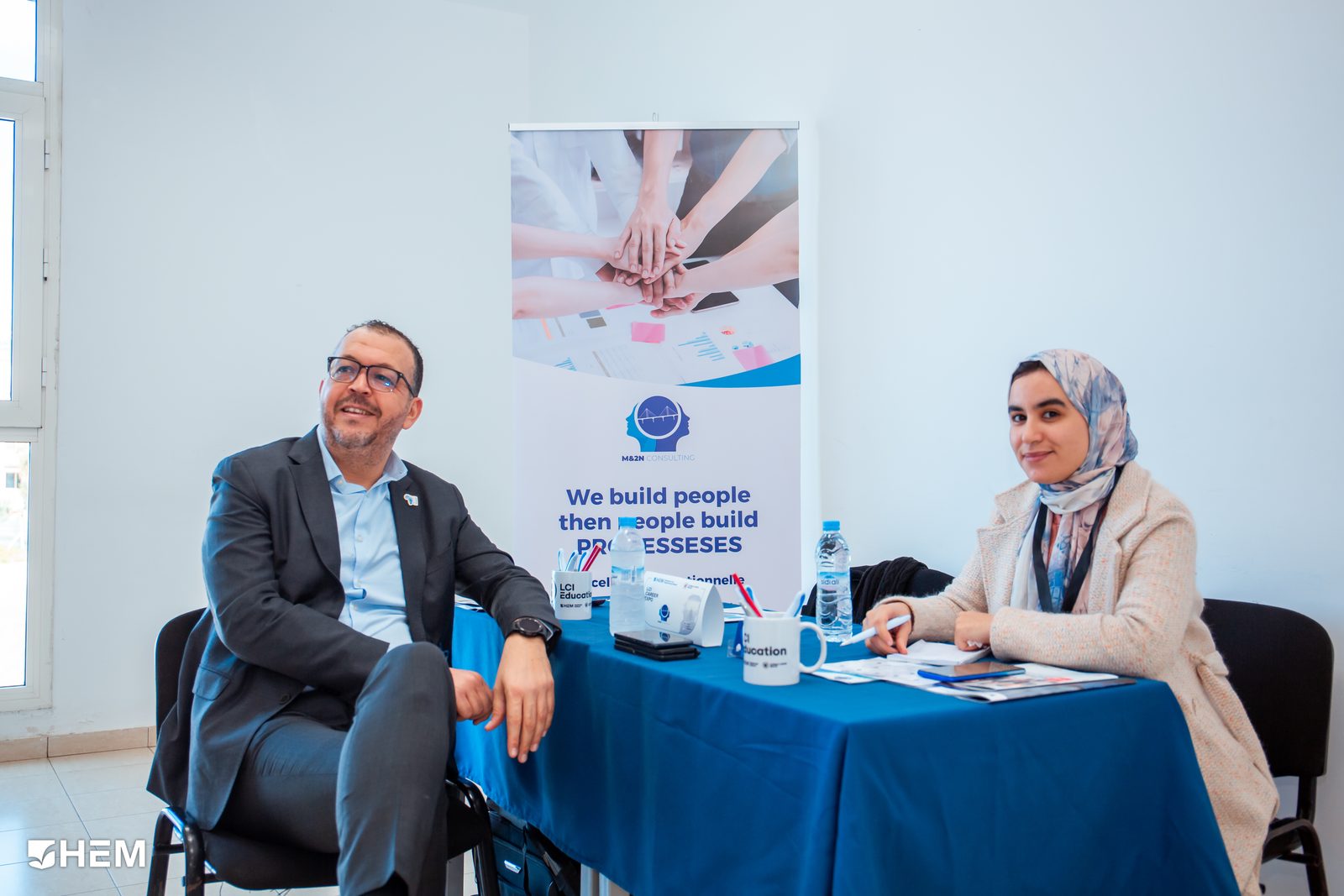 Ilyas Choubaili and a colleague at the M&2N stand during an HEM careers event.